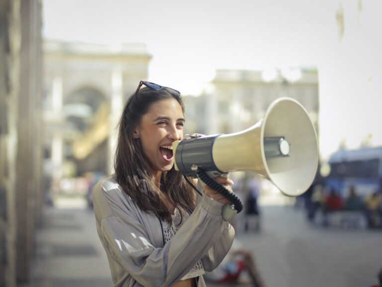 Woman holding a loudspeaker